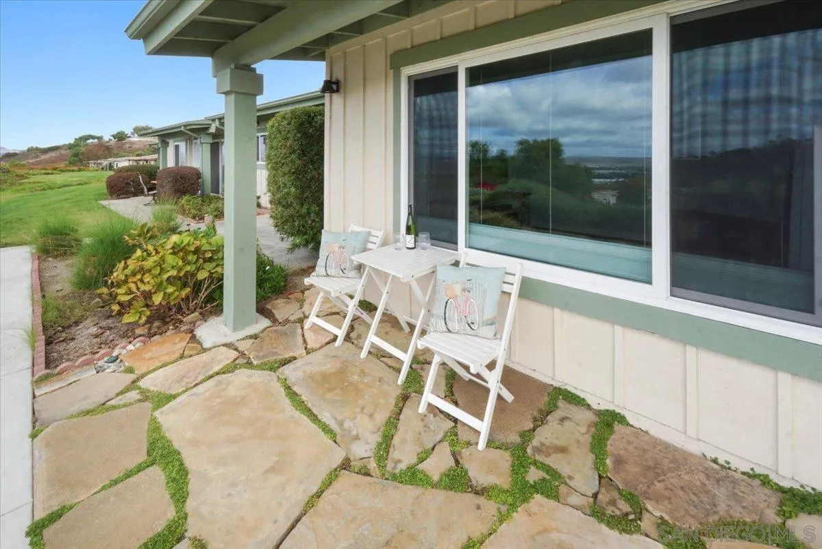 4436 Skimmer Way Oceanside, CA 92057 - Photo 31 of 71 a view of a patio with table and chairs and potted plants