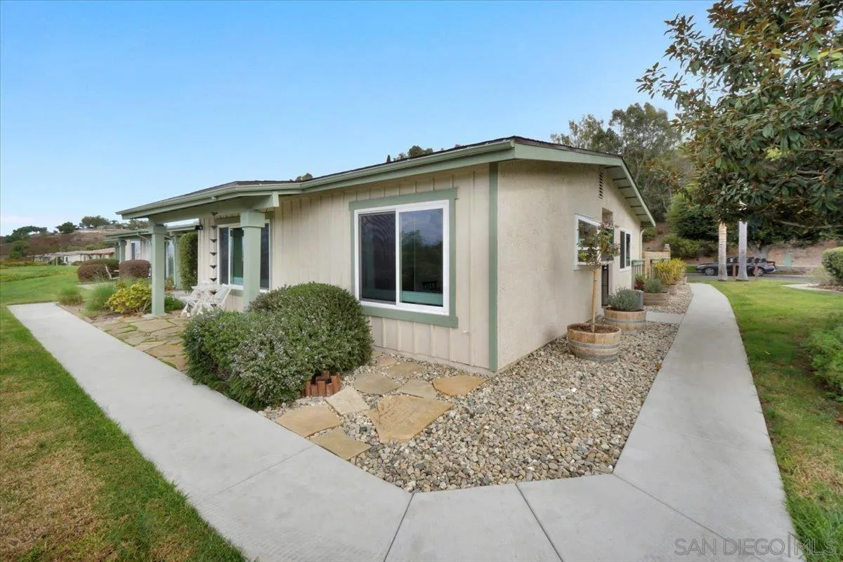 4436 Skimmer Way Oceanside, CA 92057 - Photo 38 of 71 a front view of a house with garden