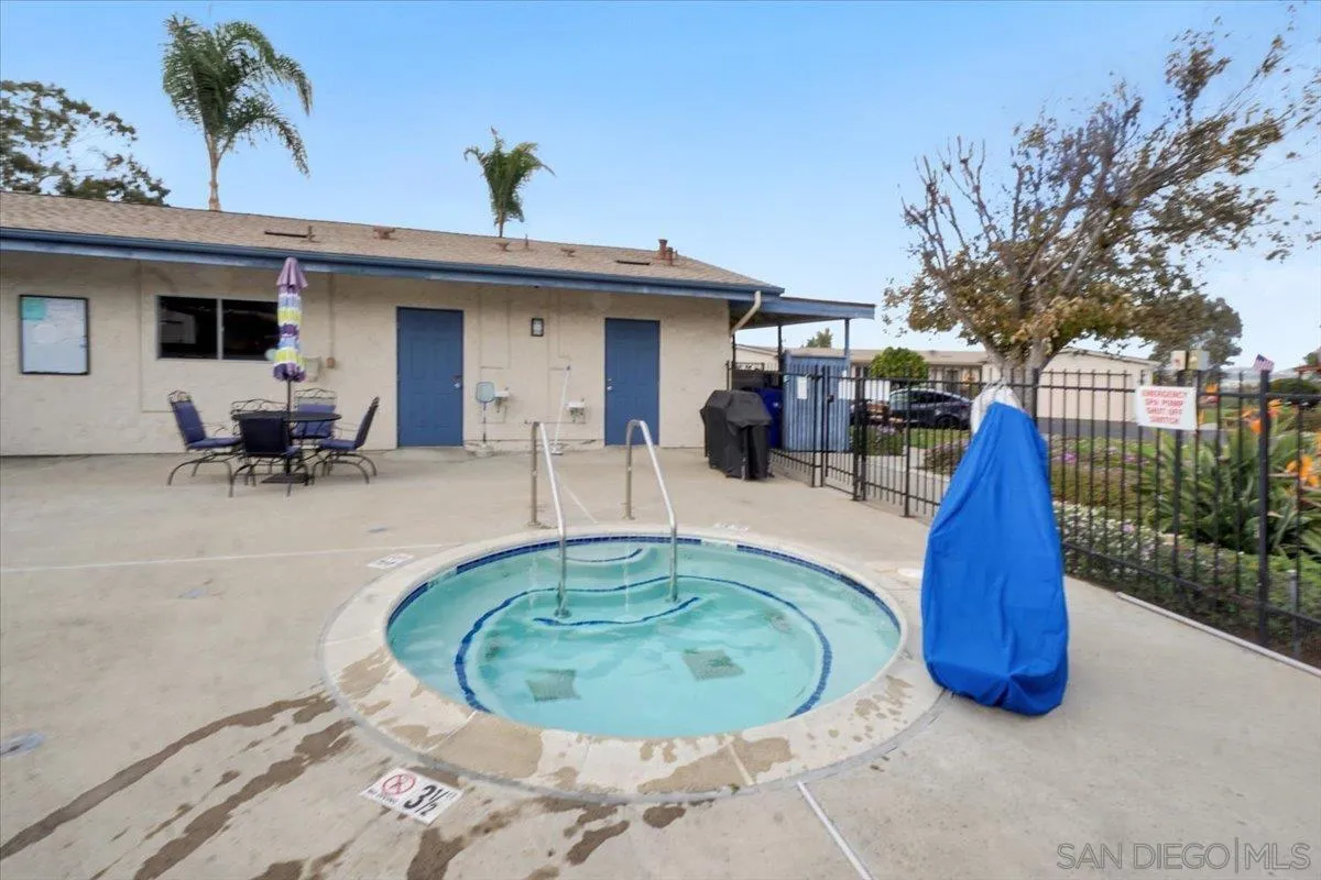 4436 Skimmer Way Oceanside, CA 92057 - Photo 52 of 71 a view of a swimming pool with a patio and a garden
