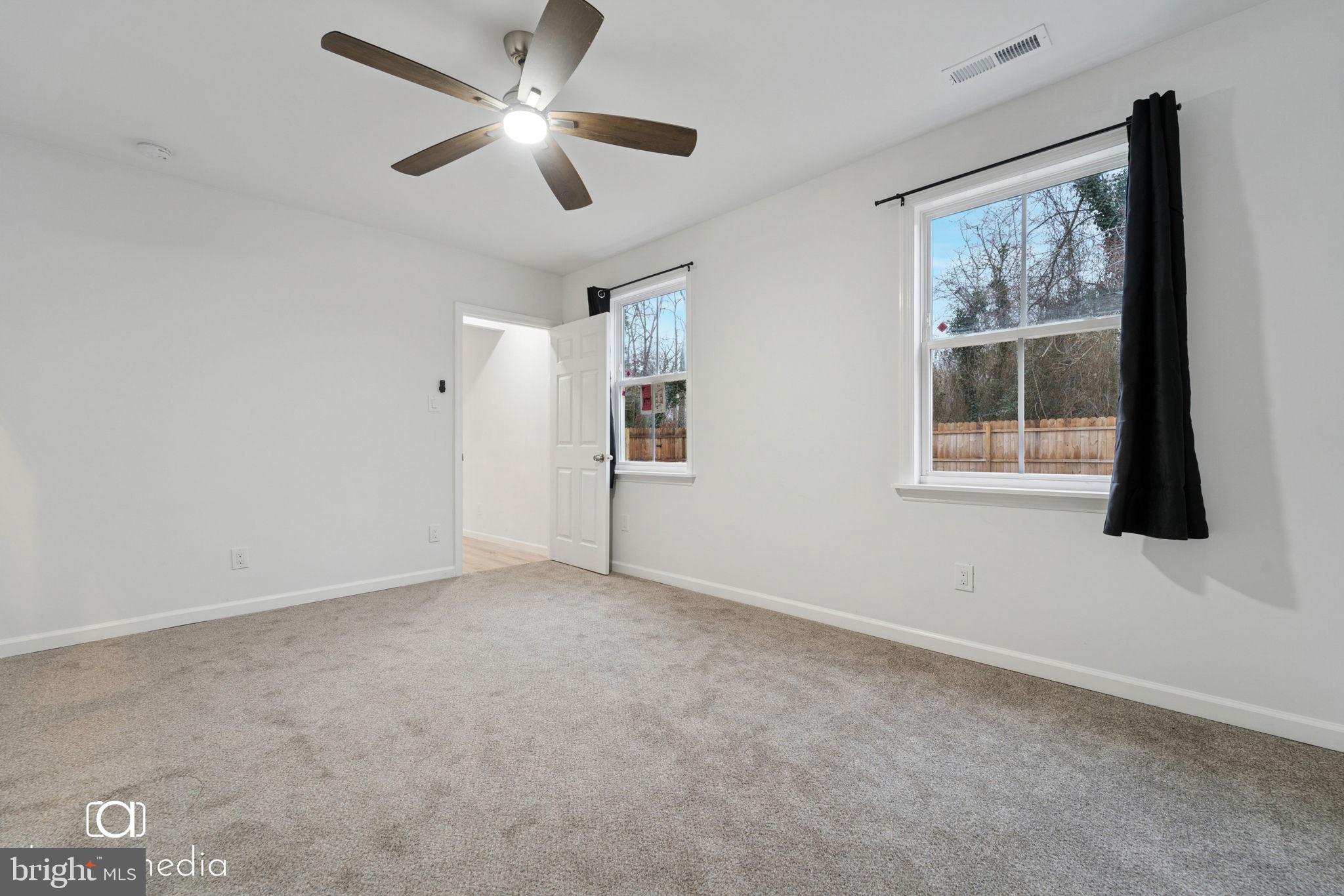303 Gooseberry Road Millville, NJ 08332 - Photo 11 of 22 a view of an empty room with a window
