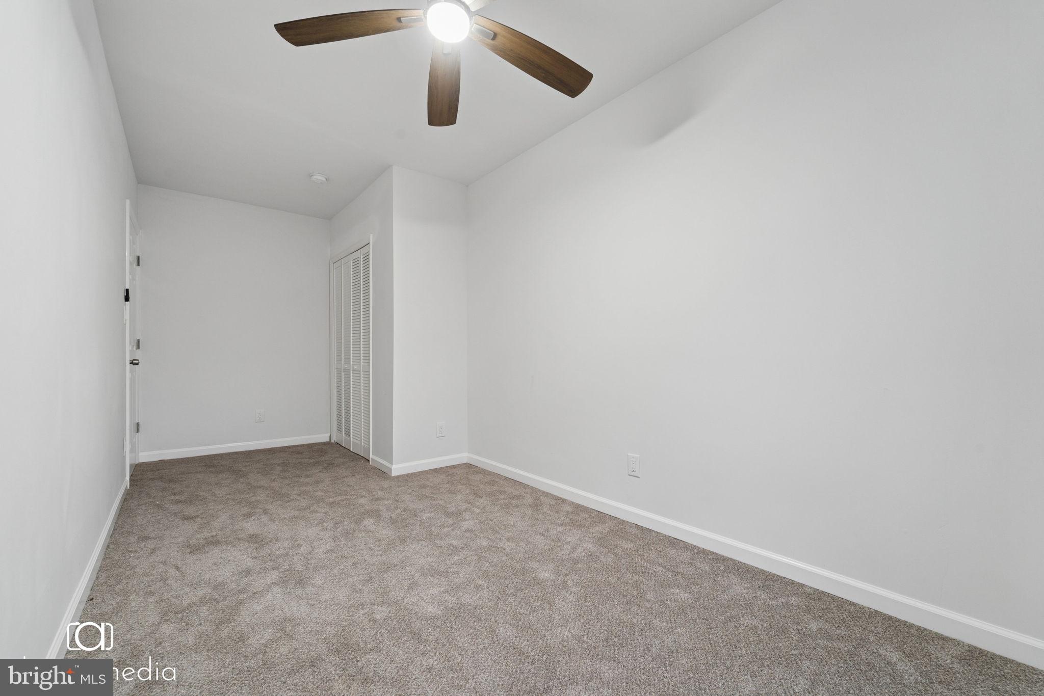 303 Gooseberry Road Millville, NJ 08332 - Photo 15 of 22 an empty room with a chandelier fan