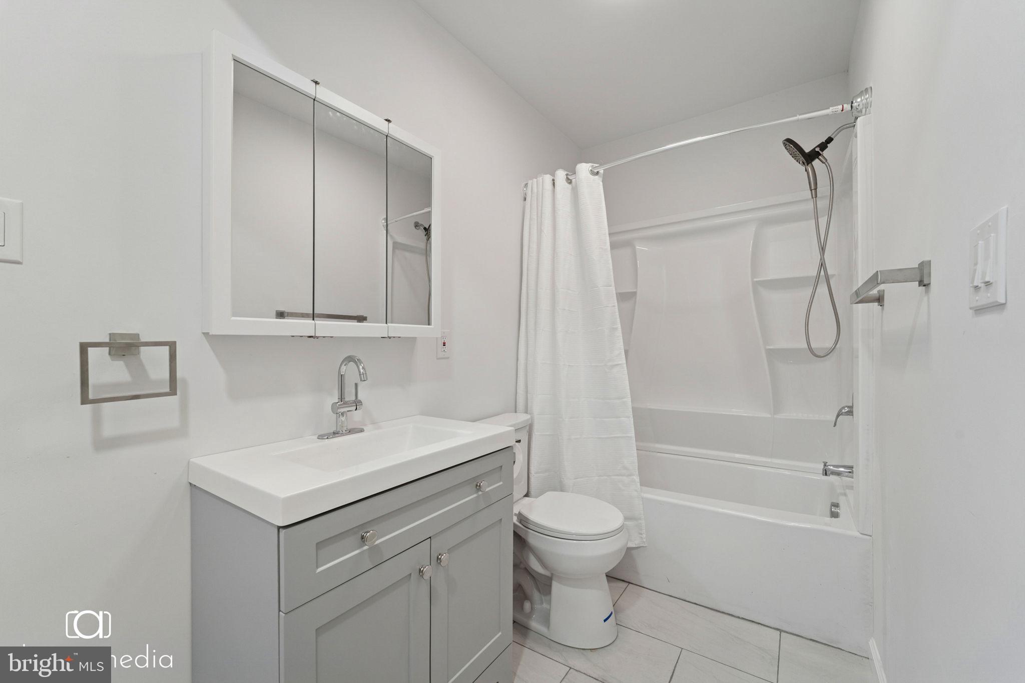 303 Gooseberry Road Millville, NJ 08332 - Photo 18 of 22 a bathroom with a sink a toilet and shower