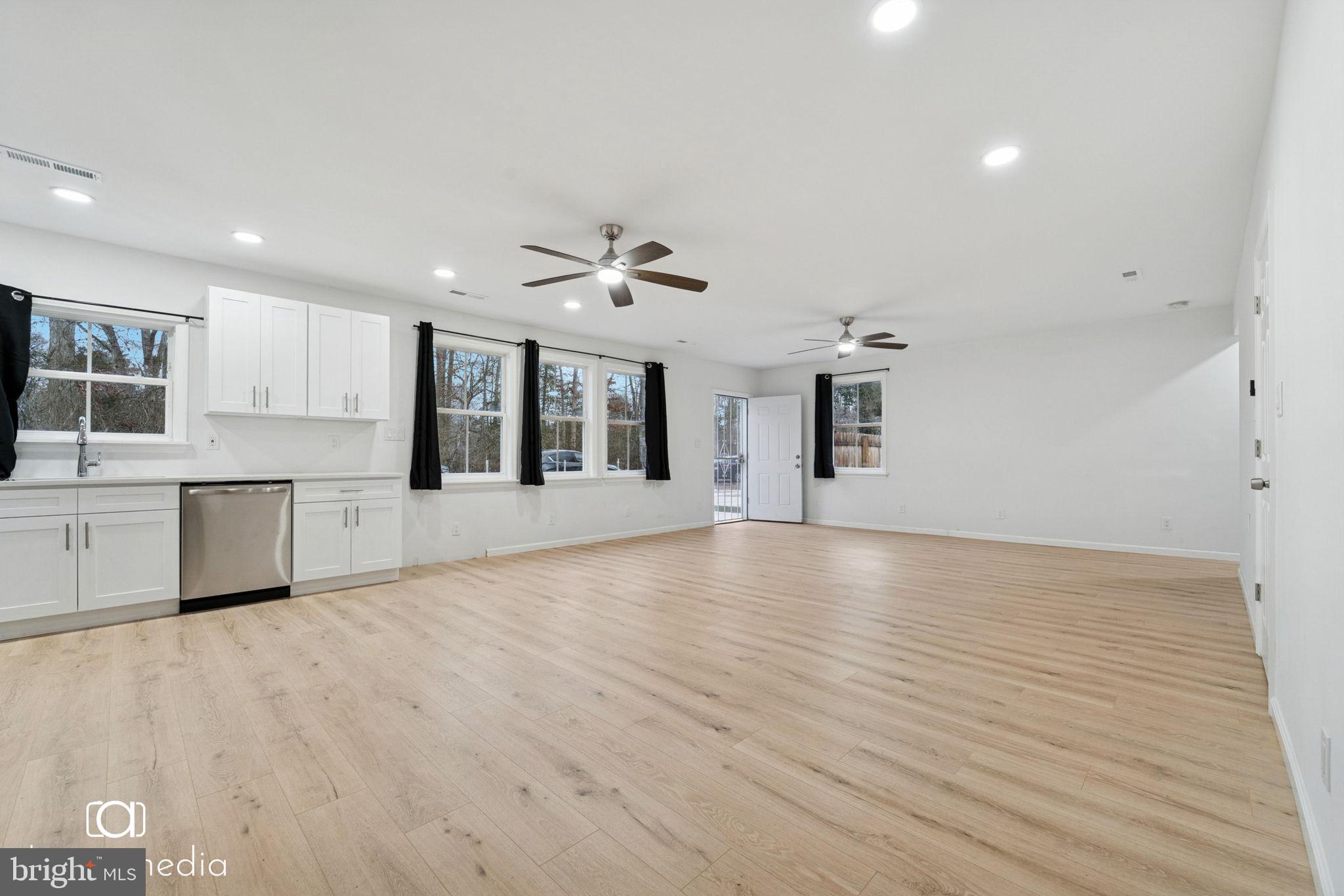 303 Gooseberry Road Millville, NJ 08332 - Photo 2 of 22 a view of a kitchen with microwave and cabinets