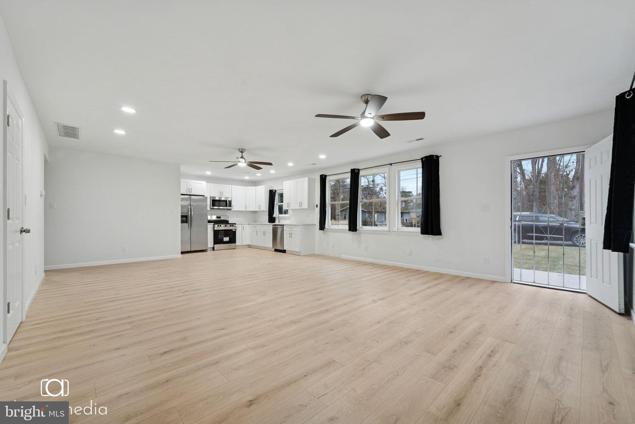 303 Gooseberry Road Millville, NJ 08332 - Photo 4 of 22 a view of a livingroom with a staircase
