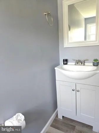 a bathroom with a sink a vanity and a mirror