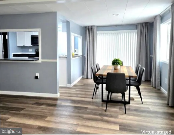 a view of a dining room with furniture and window