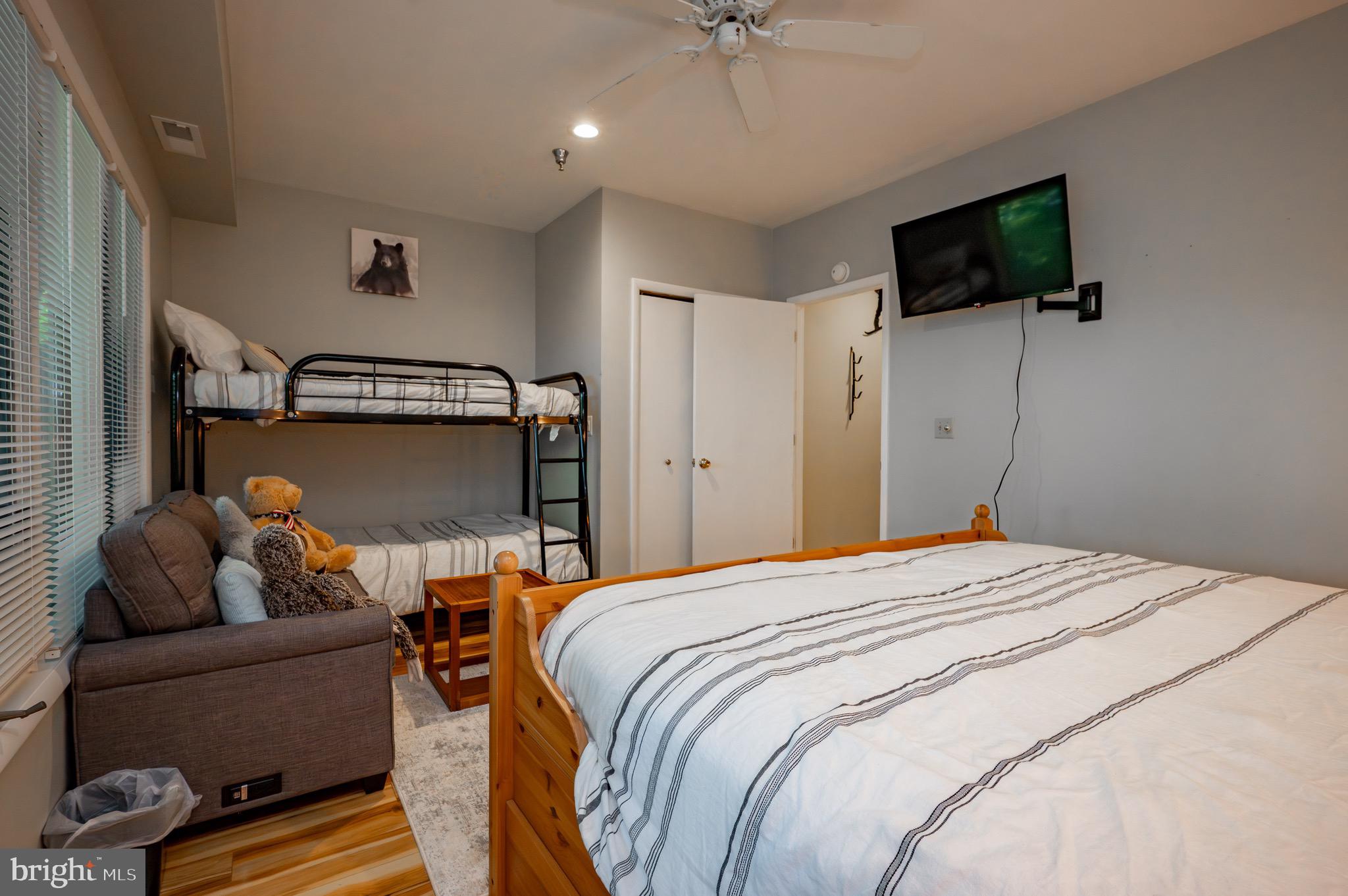257 Marsh Hill Road, Unit 44 McHenry, MD 21541 - Photo 26 of 50 a bedroom with a bed and a flat screen tv