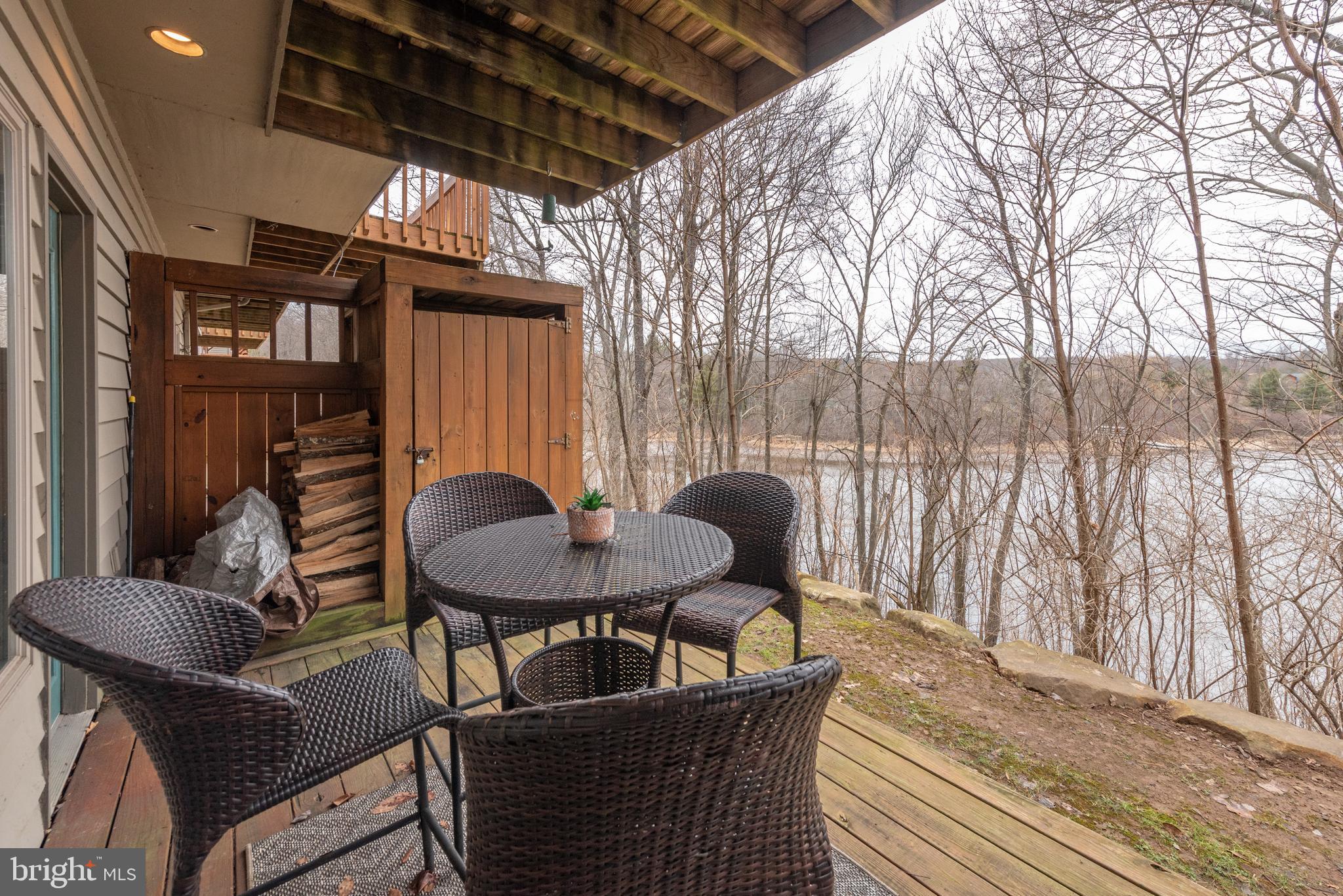 257 Marsh Hill Road, Unit 44 McHenry, MD 21541 - Photo 40 of 50 a view of a chairs and table in the patio