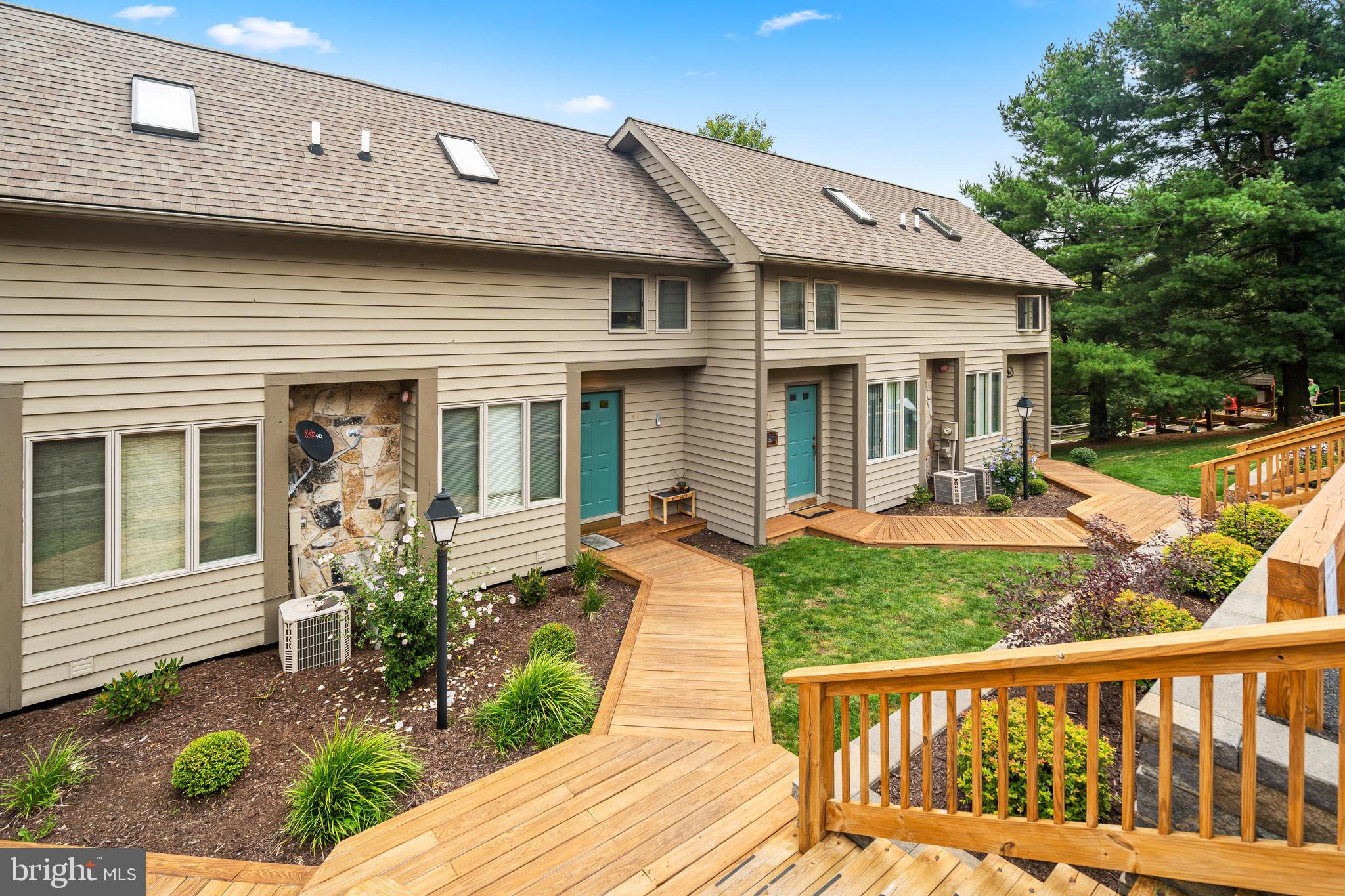 257 Marsh Hill Road, Unit 44 McHenry, MD 21541 - Photo 50 of 50 a front view of a house with garden