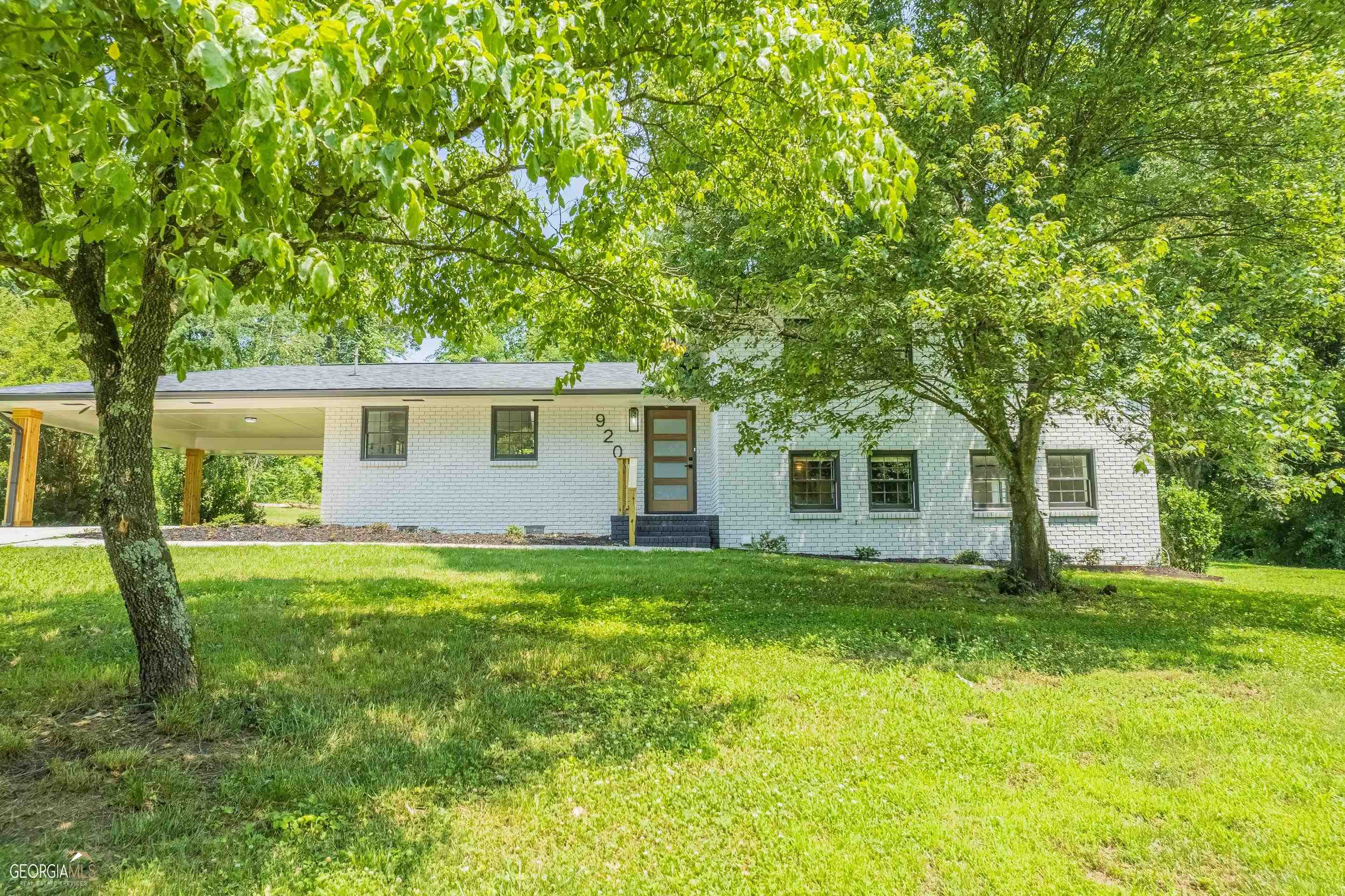 a view of a house with a yard