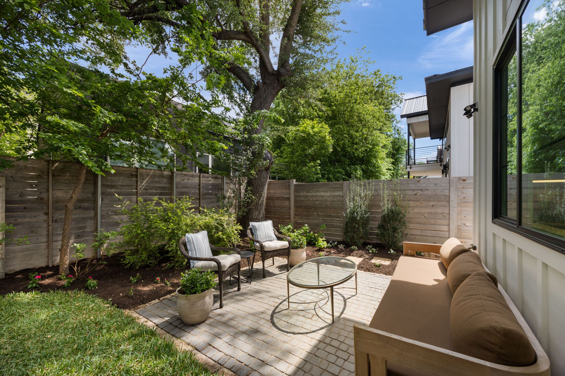 2711 Stacy Lane, Unit 2 Austin, TX 78704 - Photo 21 of 26 Deck with a patio area, a fenced backyard, and an outdoor hangout area