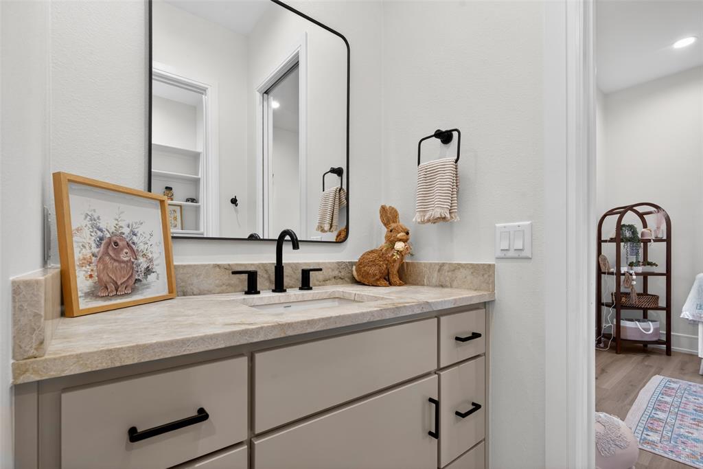 2804 Buchanan Road Hallsville, TX 75650 - Photo 29 of 40 a bathroom with a sink and a mirror