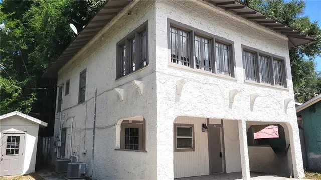a front view of a building with large windows