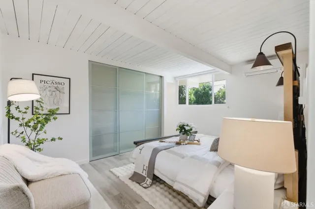 a bathroom with a shower and a sink