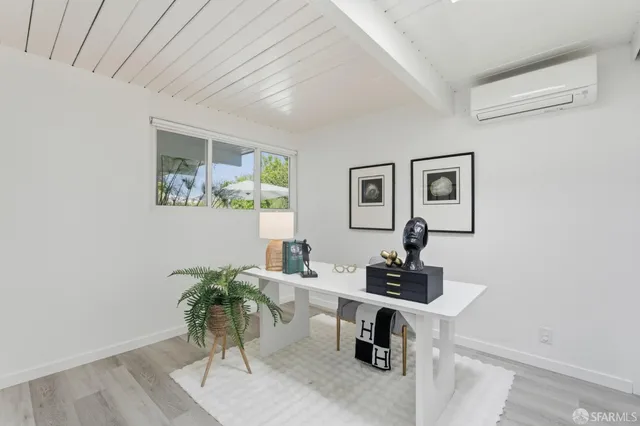 a kitchen with a table and chairs