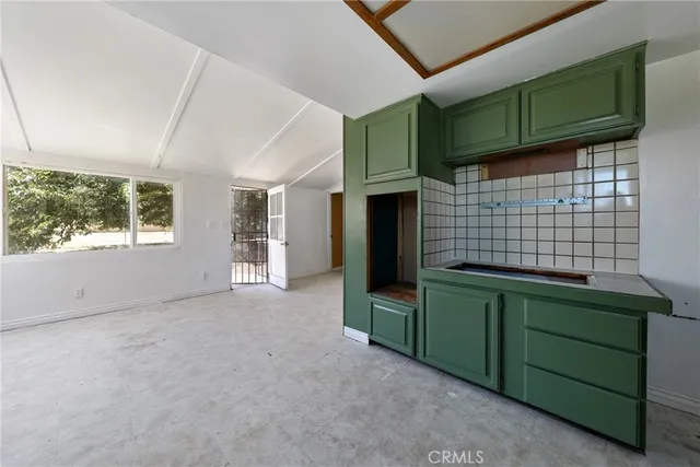 a kitchen with a sink and a refrigerator