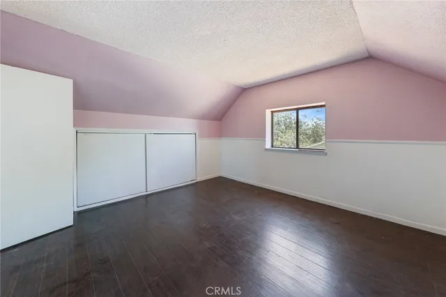 a view of a yard with car parked