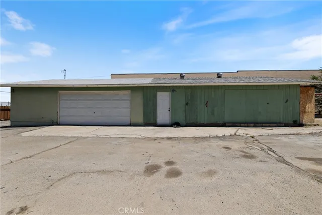 a view of a house with a road