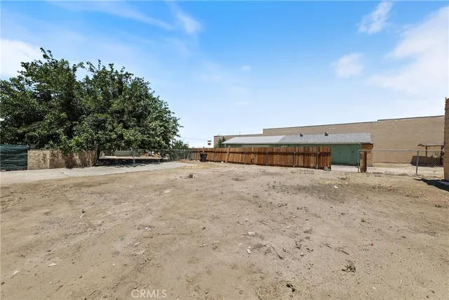 a house with trees in the background