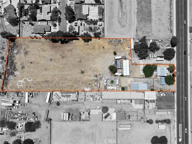 an aerial view of multiple houses with yard