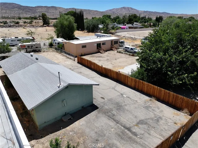 an aerial view of a house with outdoor space
