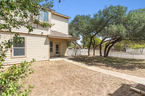 a view of a house with a yard and garage