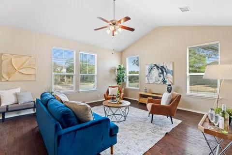 a living room with furniture and a large window