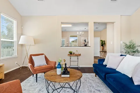 a living room with furniture and a table