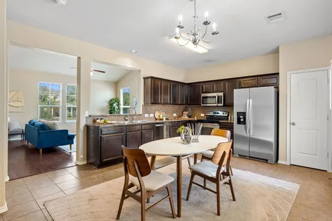 a view of a dining room with furniture and window