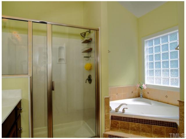 2809 Cowley Road Cary, NC 27518 - Photo 14 of 25 Separate Tiled Jetted Tub and Large Shower with Seat. Glass Block Window, Walk in Closet.