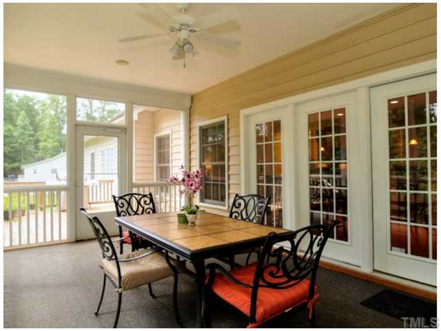 2809 Cowley Road Cary, NC 27518 - Photo 15 of 25 Large Screened Porch getting new outdoor carpet, Ceiling Fan and Built in Speakers.