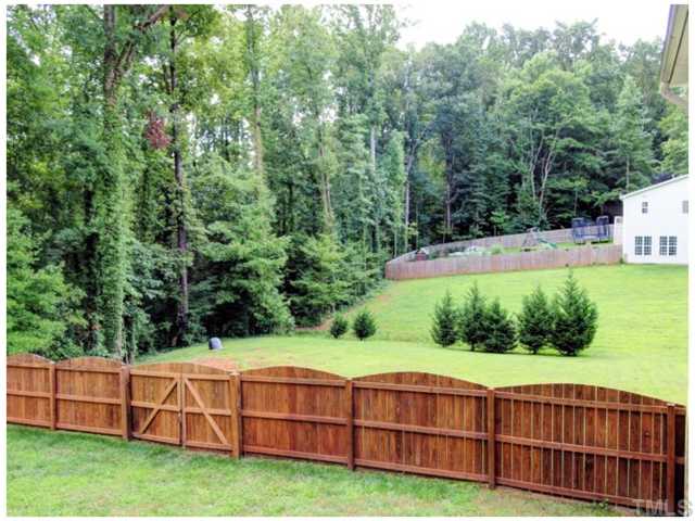 2809 Cowley Road Cary, NC 27518 - Photo 18 of 25 Yard goes beyond the fence to the tree line, and look how FAR your neighbor is!