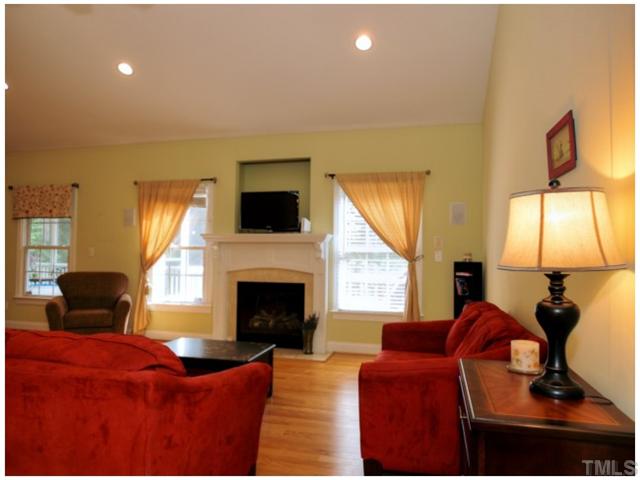 2809 Cowley Road Cary, NC 27518 - Photo 10 of 25 Family Room with Recessed Lights, Hardwoods, Gas Log Fireplace, Vaulted Ceiling, Surround Sound