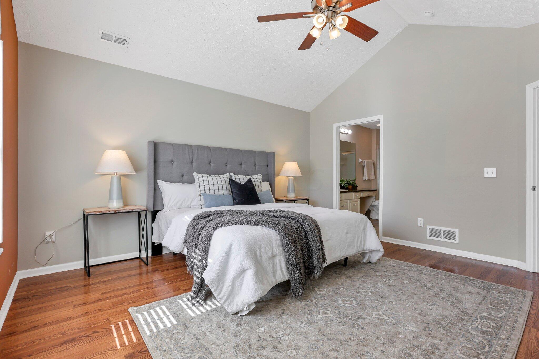 4223 Cobbler Road, Unit 16422 New Albany, OH 43054 - Photo 12 of 36 Primary suite with vaulted ceilings and attached full bathroom.