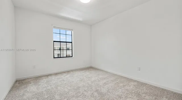 a view of a bathroom from the hallway