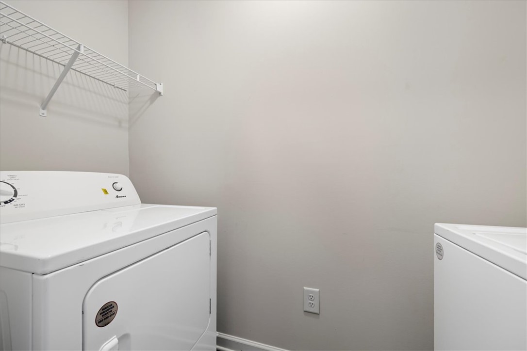117 Adger Road Pendleton, SC 29670 - Photo 27 of 36 This dedicated laundry space offers practical storage and appliance hookups for convenience.