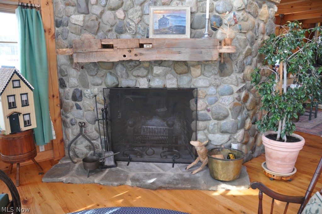 12463 Pond Road Burton, OH 44021 - Photo 21 of 23 Close up of Great Room fireplace with barn beam mantle