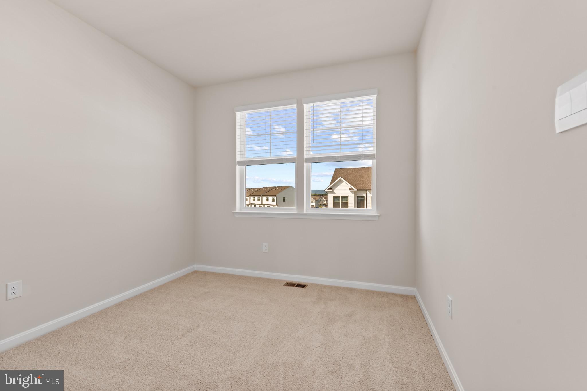 329 Ensemble Way Frederick, MD 21701 - Photo 21 of 40 an empty room with a window