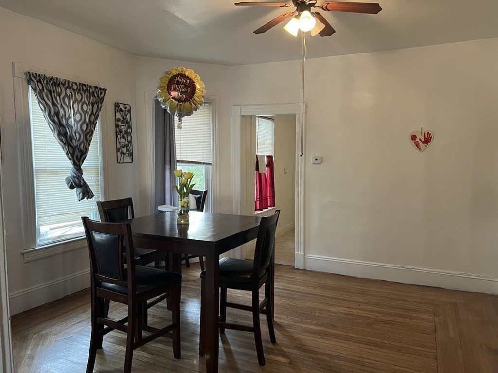 218 Oakland Street Springfield, MA 01108 - Photo 3 of 4 a view of a dining room with furniture and wooden floor