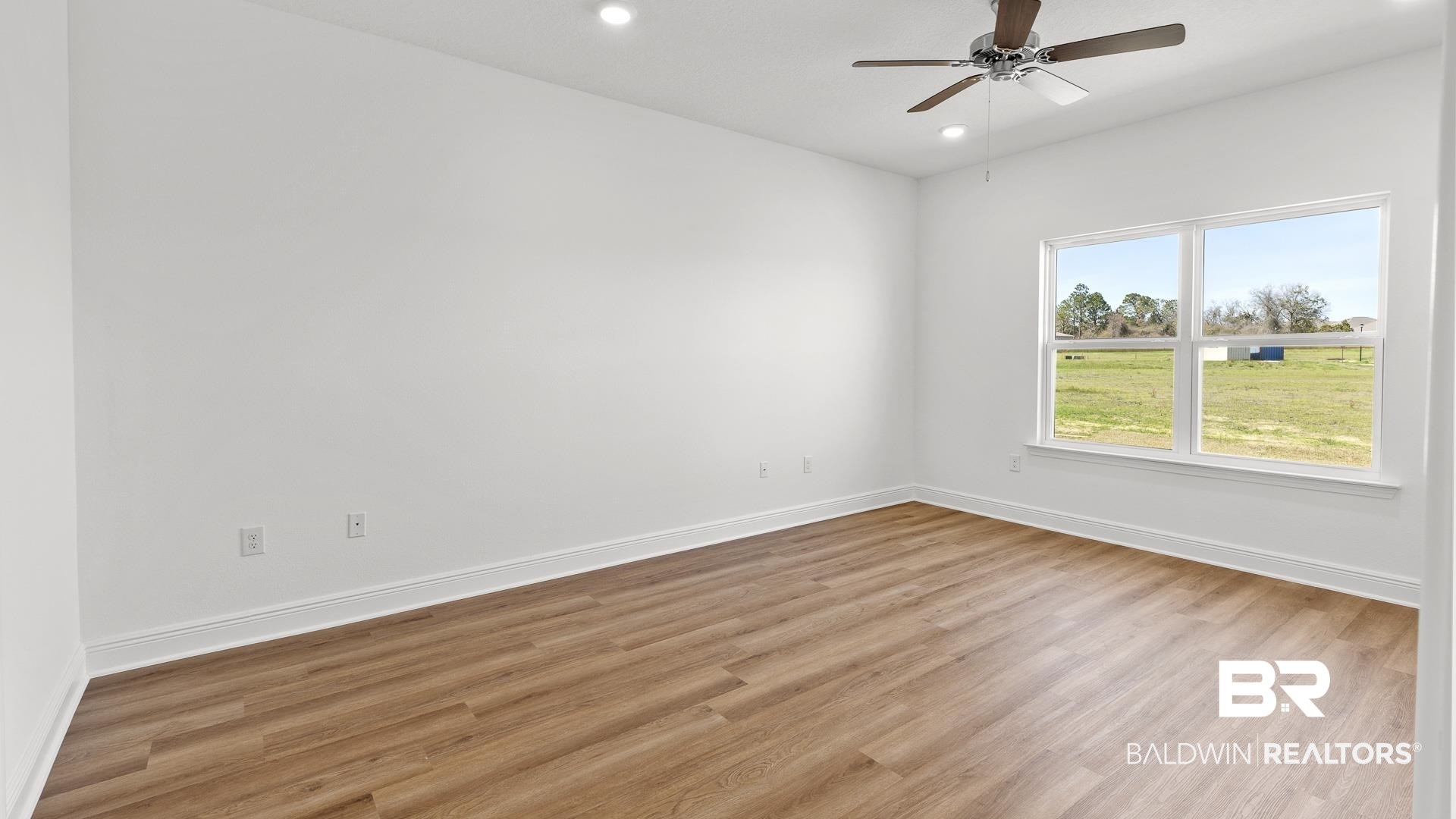 12931 Grand Rpds Road Fairhope, AL 36532 - Photo 21 of 33 Spare room featuring recessed lighting, ceiling fan, light wood-style floors, and baseboards