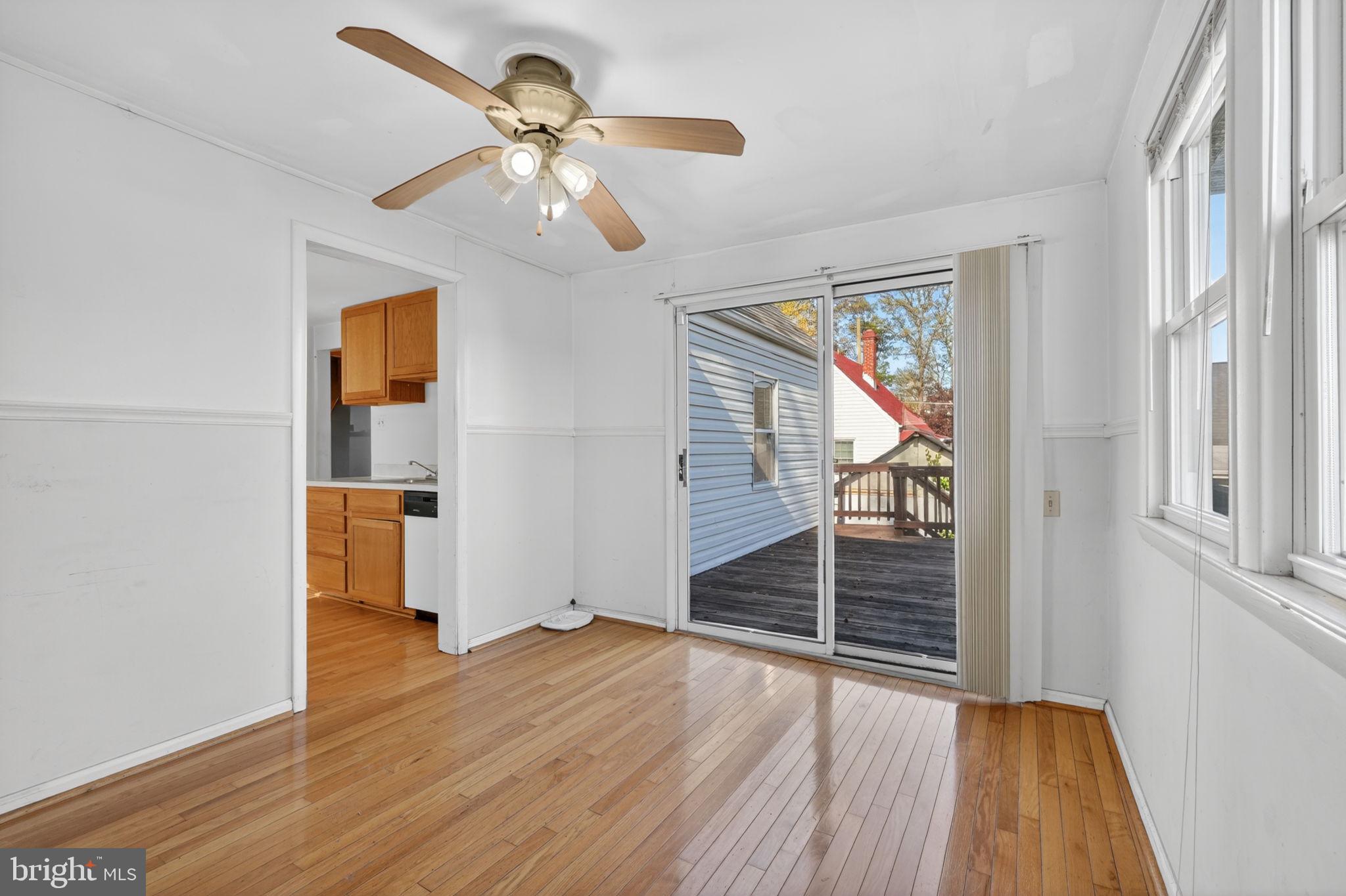 5441 Taussig Road Bladensburg, MD 20710 - Photo 12 of 37 wooden floor in an empty room with a window