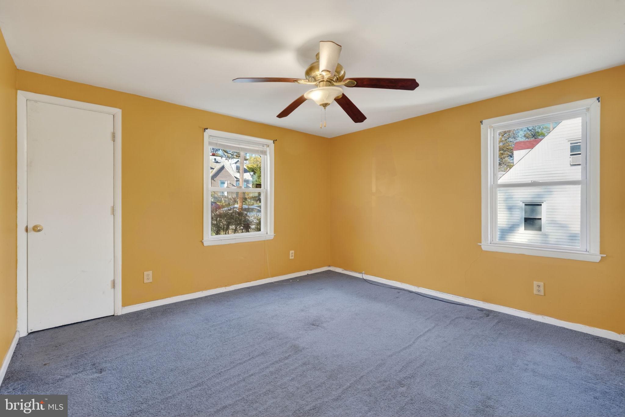 5441 Taussig Road Bladensburg, MD 20710 - Photo 14 of 37 a view of an empty room with window and wooden floor