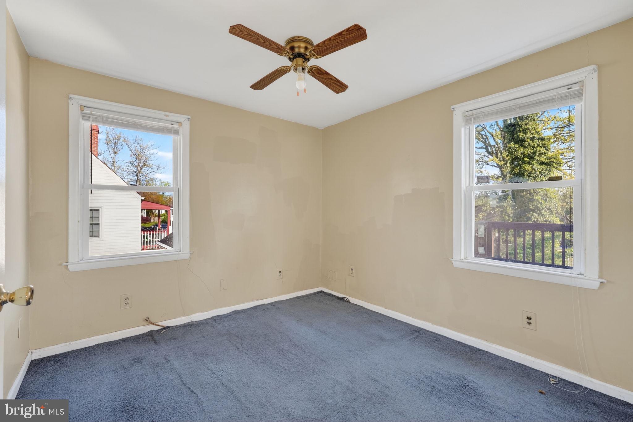 5441 Taussig Road Bladensburg, MD 20710 - Photo 16 of 37 an empty room with a window and a ceiling fan