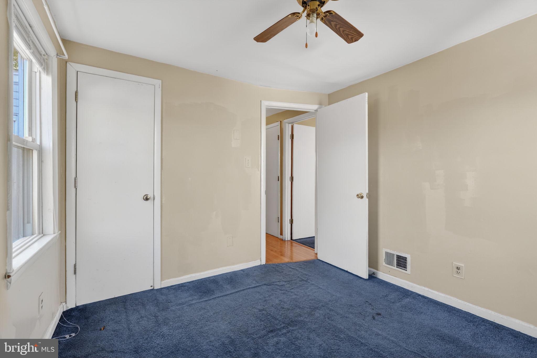 5441 Taussig Road Bladensburg, MD 20710 - Photo 17 of 37 an empty room with a empty space and a ceiling fan