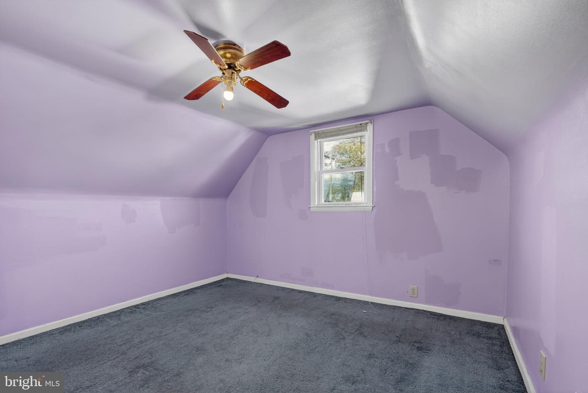 5441 Taussig Road Bladensburg, MD 20710 - Photo 20 of 37 an empty room with a ceiling fan and window