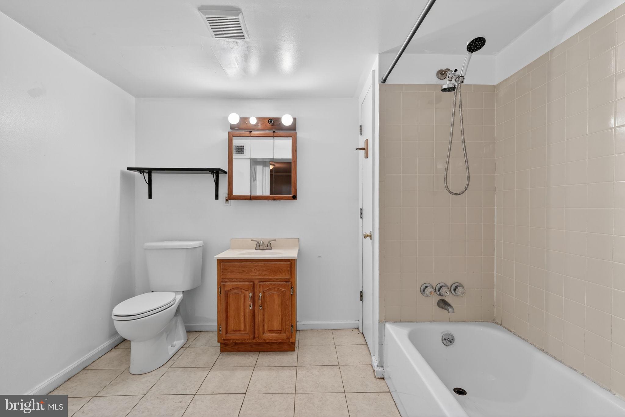 5441 Taussig Road Bladensburg, MD 20710 - Photo 27 of 37 a bathroom with a toilet sink and shower