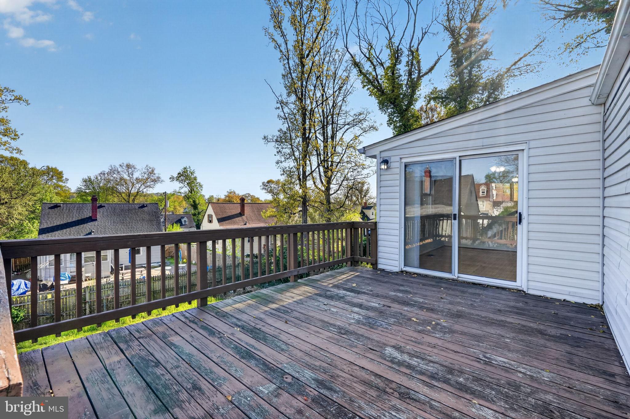 5441 Taussig Road Bladensburg, MD 20710 - Photo 28 of 37 a view of a wooden deck with a yard
