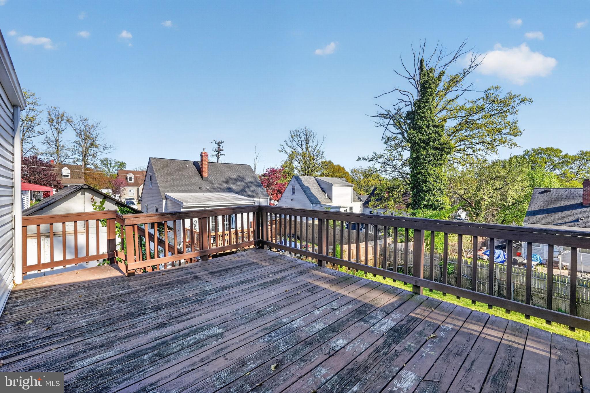 5441 Taussig Road Bladensburg, MD 20710 - Photo 29 of 37 a balcony with wooden floor table and chairs