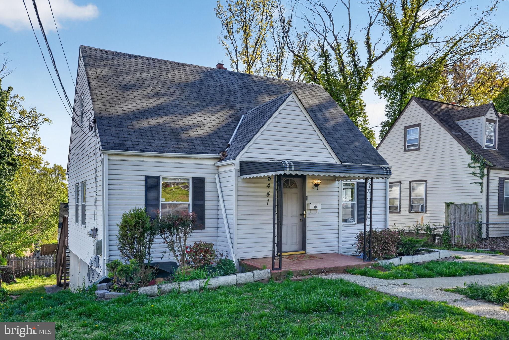 5441 Taussig Road Bladensburg, MD 20710 - Photo 36 of 37 a front view of a house with a yard and green space