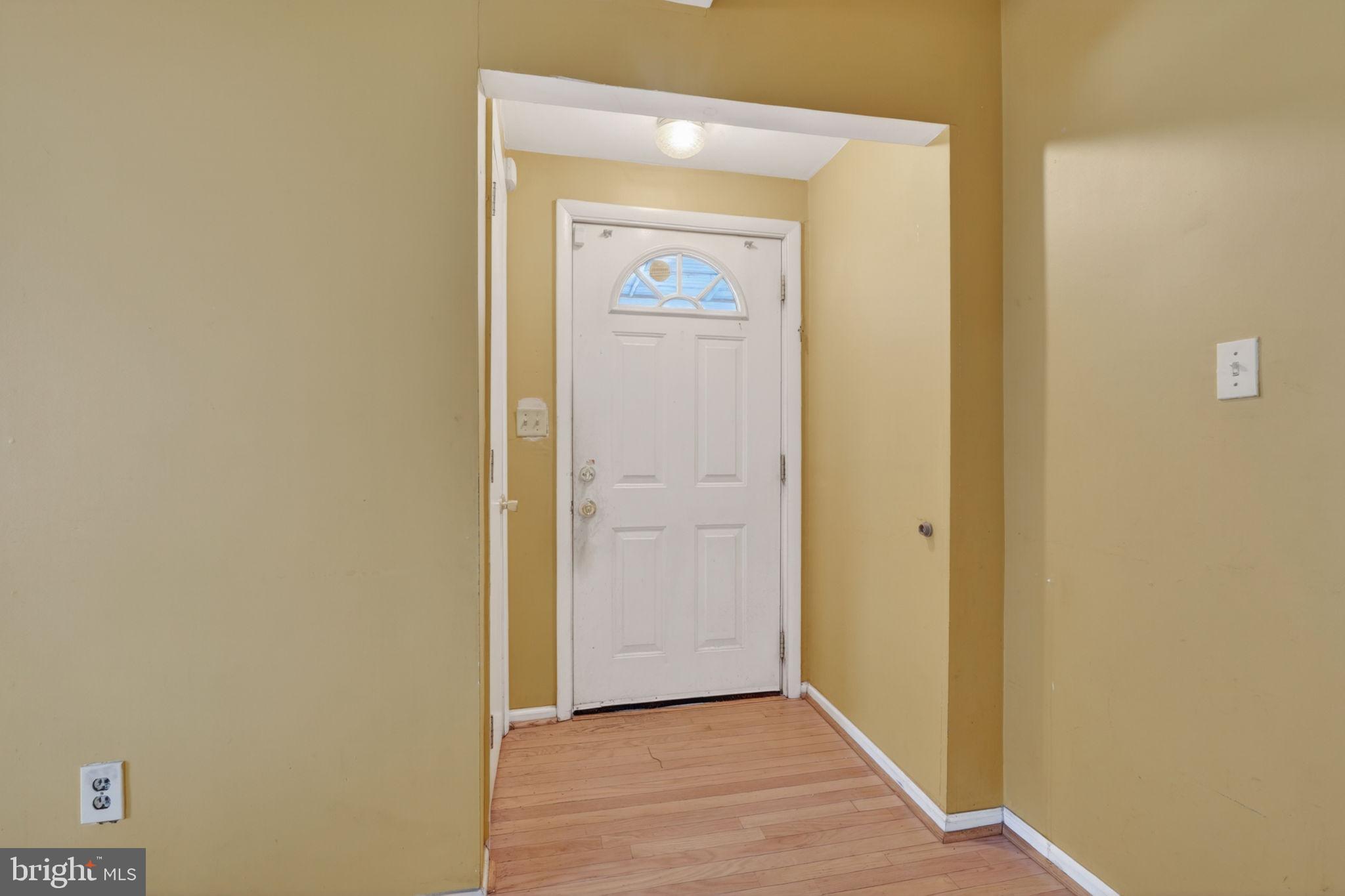 5441 Taussig Road Bladensburg, MD 20710 - Photo 4 of 37 a view of a hallway with wooden floor